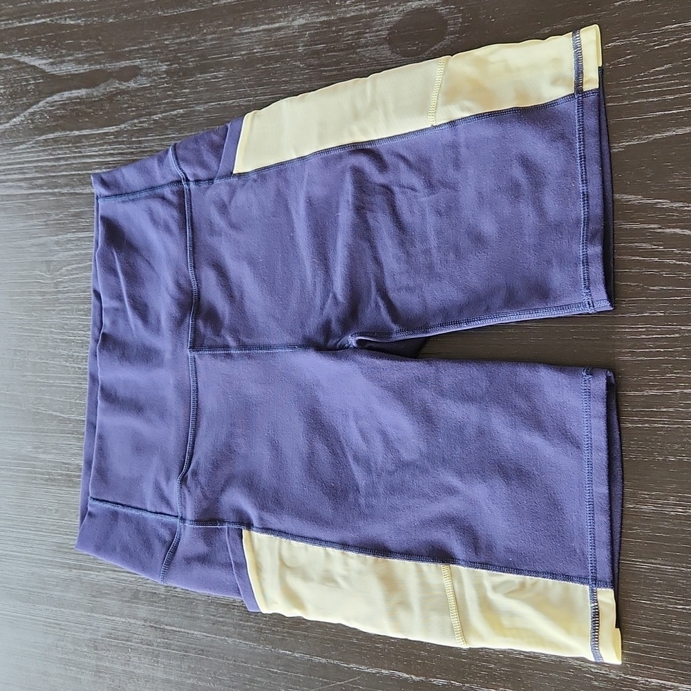 Fabletics High-Waisted 9" Powerhold Biker Short Blue and Yellow